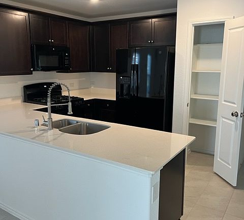Kitchen. Refrigerator and mic0rwave included. Pantry closet.