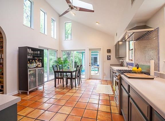 Amazing eat in kitchen with vaulted ceilings and walls of windows, great for entertaining!