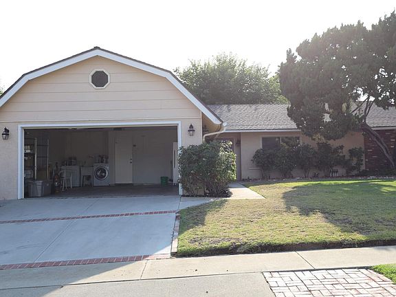 Front yard and 2 car garage with washer and dryer and freezer.
