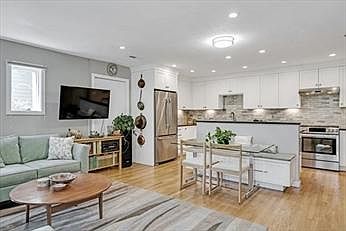 Open concept LR, view into kitchen