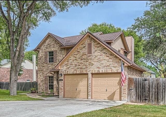 Welcome Home! Picturesque front entrance with 2 car garage and space for additional parking