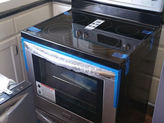 New stainless steel appliances being installed