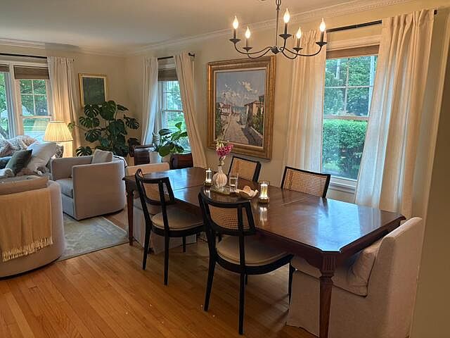 Dining area with overhead chandelier