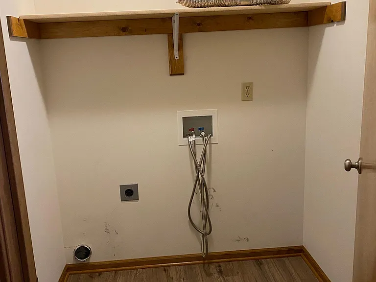 upstairs laundry room by kitchen