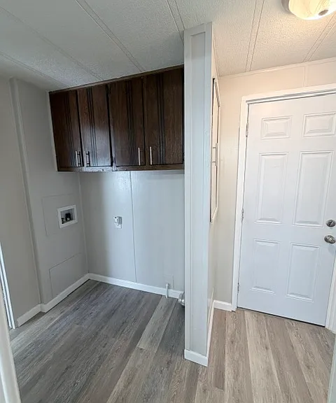 Laundry hook up & cabinet storage