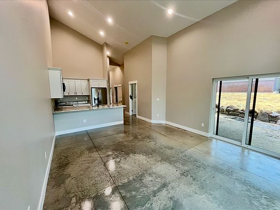 Family room with sliding glass door to patio overlooking the golf course