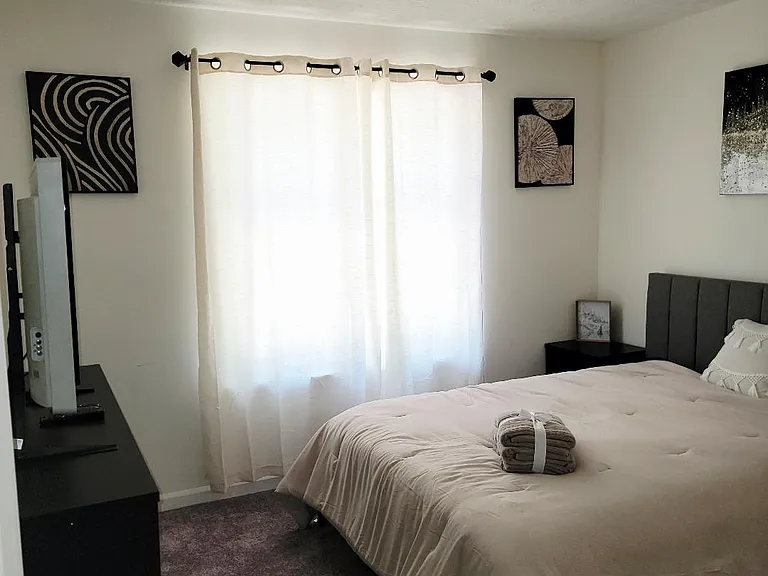 QUEEN BED WITH DESK AND CLOSET 42IN TV DRESSER NIGHTSTAND AND MIRROR, COMES WITH BEDDING AND TOWELS ALL YOU NEED IS PILLOWS