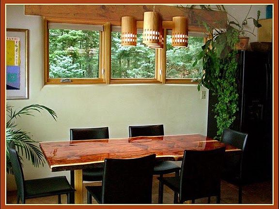 Dining area. Custom cedar wood lighting fixtures on dimmers throughout the house.