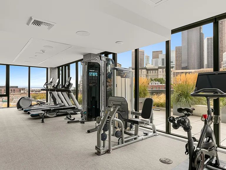 gym with equipment and Peleton