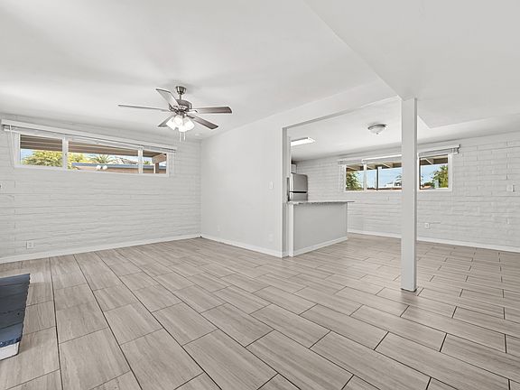Open-concept flow connects the entry straight through to the kitchen and living area.