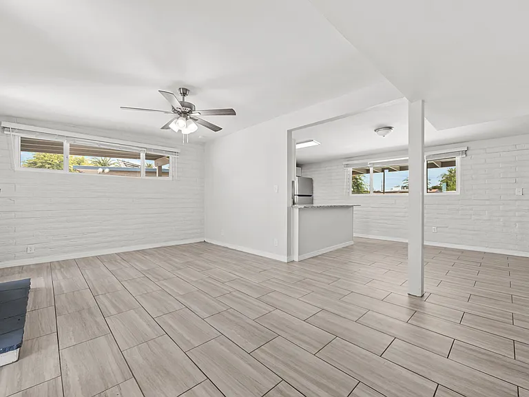 Open-concept flow connects the entry straight through to the kitchen and living area.