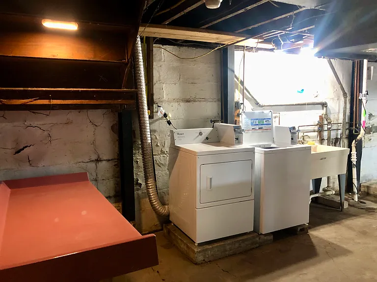 New coin operated laundry machines in basement