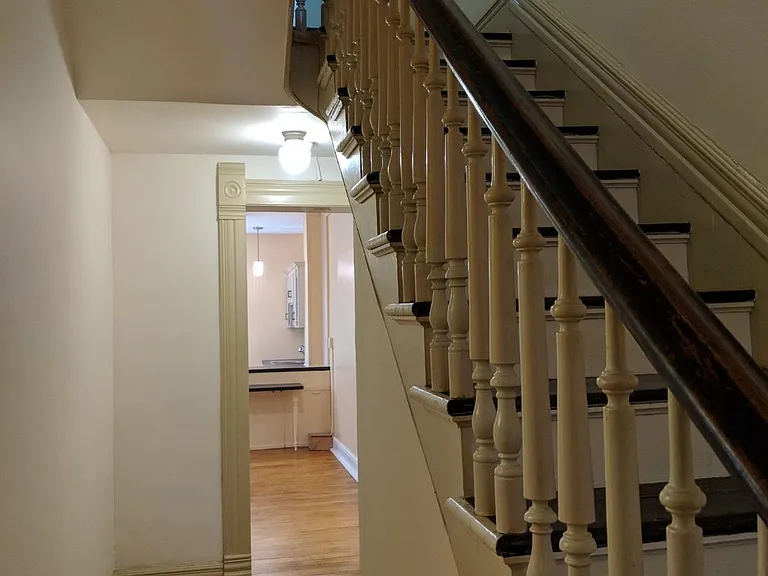 downstairs hallway looking into kitchen area