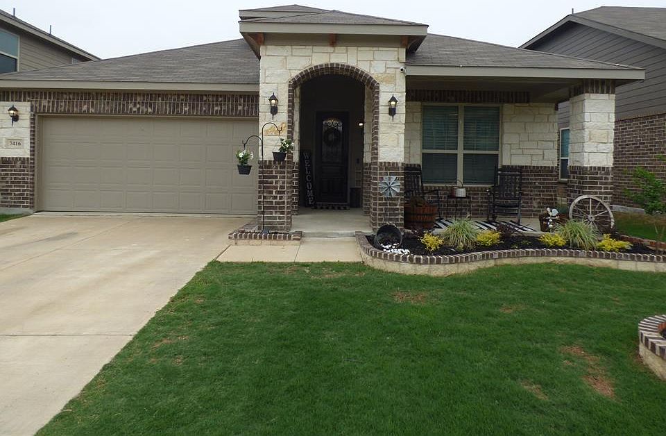 Full View Outside 7416 Boat Wind Rd
Front covered Patio with Front lawn