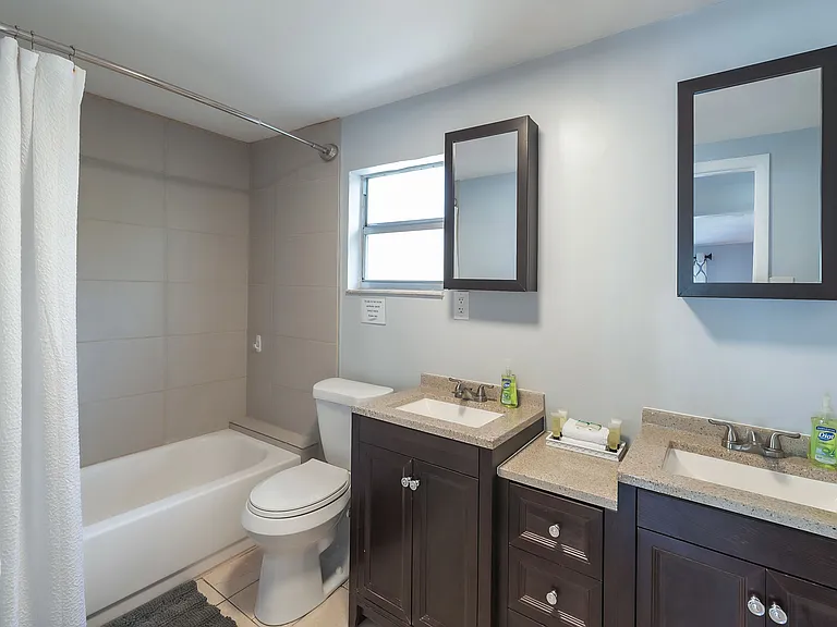 Bathroom w/ Double Vanity, Shower + Tub