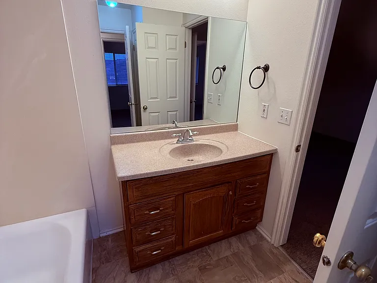 Bathroom upstairs. Taken from doorway into hall. There is a toilet to the left and a linen closet to the right, not pictured.
