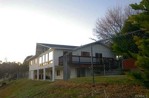 View of side of house that is facing away from street. Pool beh
