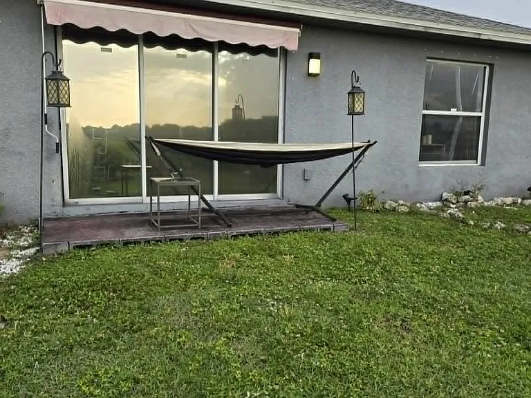 Outdoor hammock area perfect for relaxing, enjoying the Florida weather, reading a book, watching the night sky, or simply unwinding after a long day.