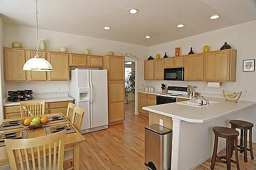 Spacious dine-in kitchen with breakfast bar.