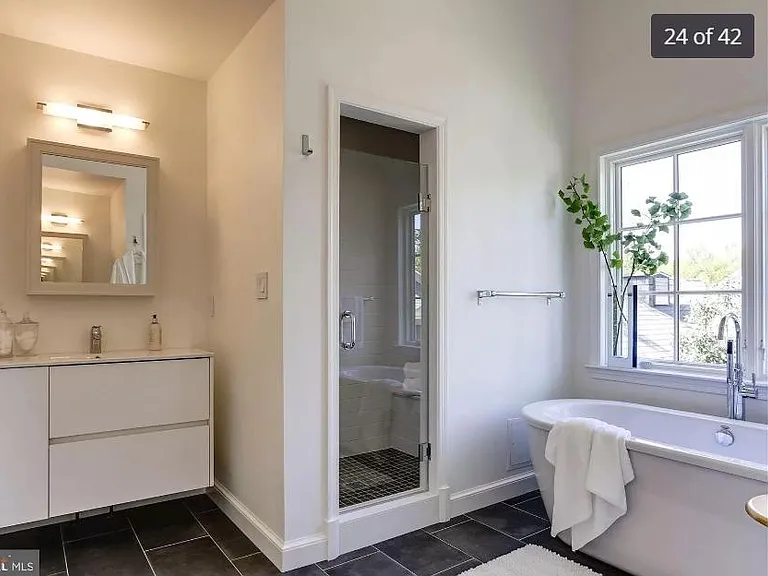 Renovated master ensuite bath with two separate vanities