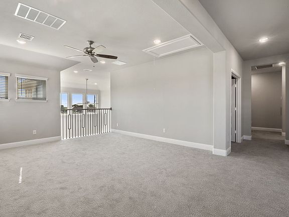 Game room in the Olympic home plan by Trophy Signature Homes - REPRESENTATIVE PHOTO