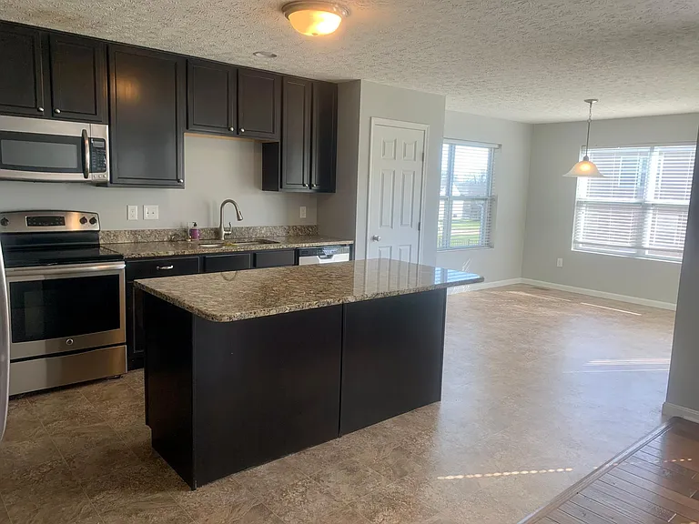 Kitchen- granite counter tops, stainless steel appliances, 42 inch cabinets