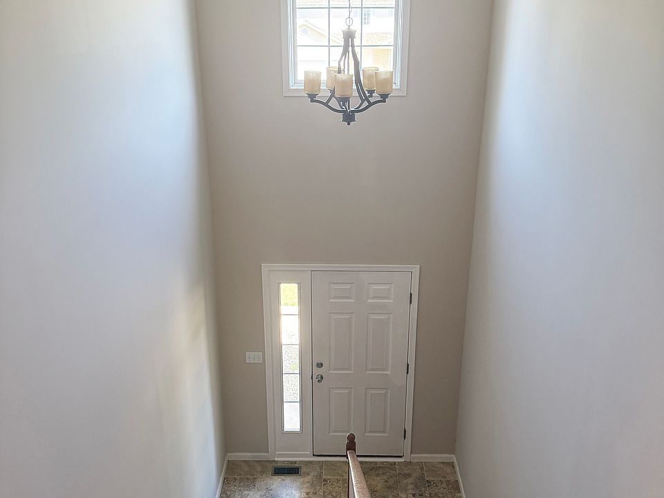 FRONT ENTRANCE FROM THE TOP OF THE STAIRS