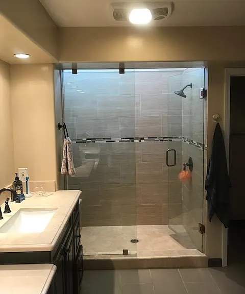 Modern Walk-in shower; his and hers sinks