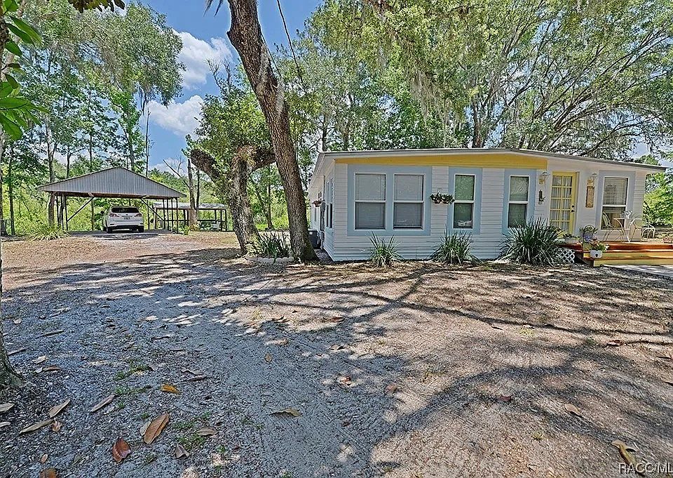 house and double carport, large yard
