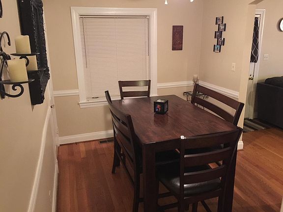Dining room with ceiling fan or area for office.