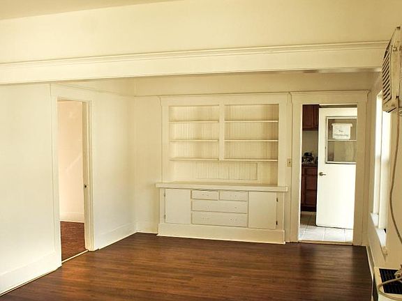 Living Room w/Built-In Cabinetry, Laminate Flooring & A/C