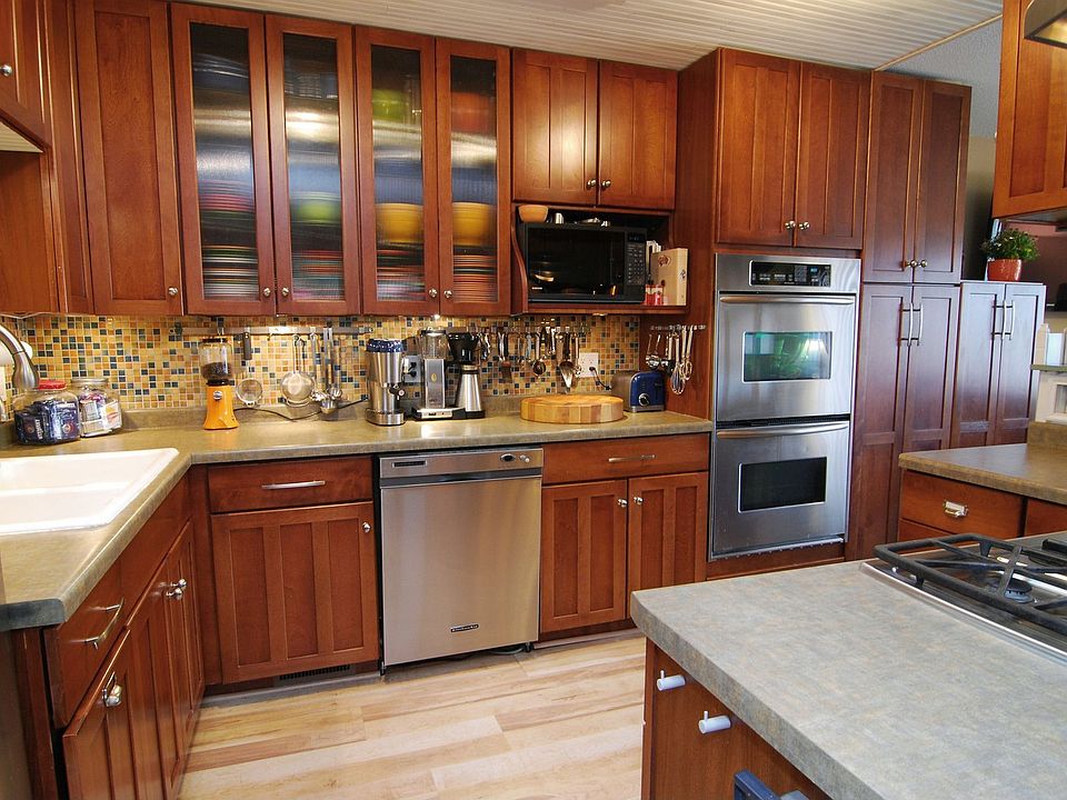 Gourmet kitchen w/ double convection ovens, gas five burner cook top.
