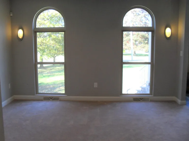 Sitting room looks out onto front yard.