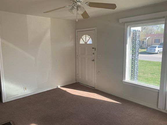 Inside living room, looking at front door