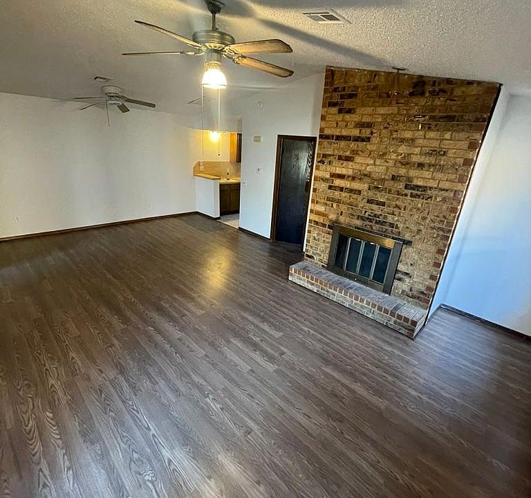Living area from front door view, with fireplace