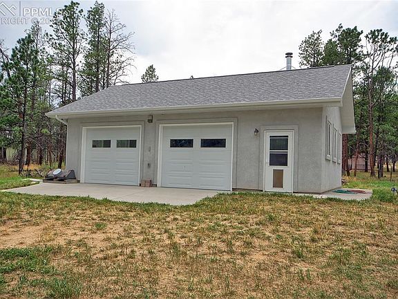 900 sq ft detached garage with workshop is heated and insulated