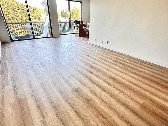 Unit #302 massive living room with stunning brand-new luxury vinyl flooring!