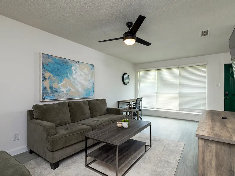 Spacious living room with plenty of seating for friends and family.