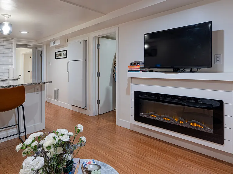 Open concept living area with electric fire place