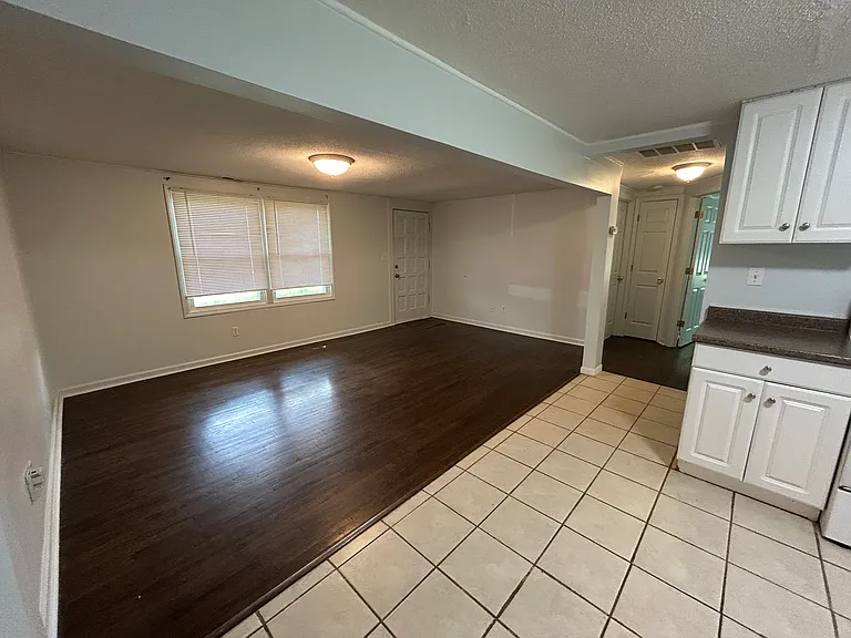 The bathroom, bedrooms, and storage spaces are just past the living room.