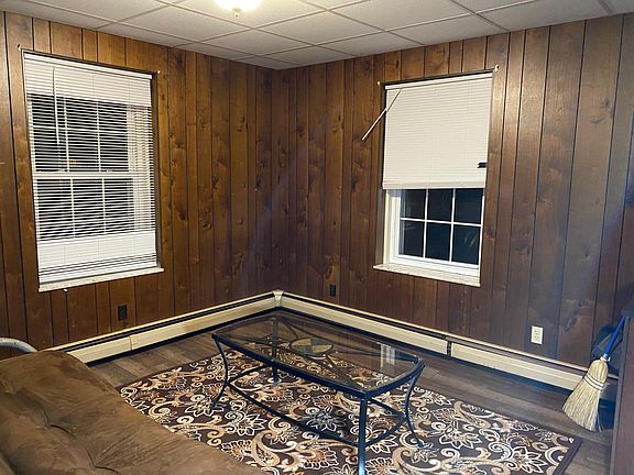 opposite wall from couch.