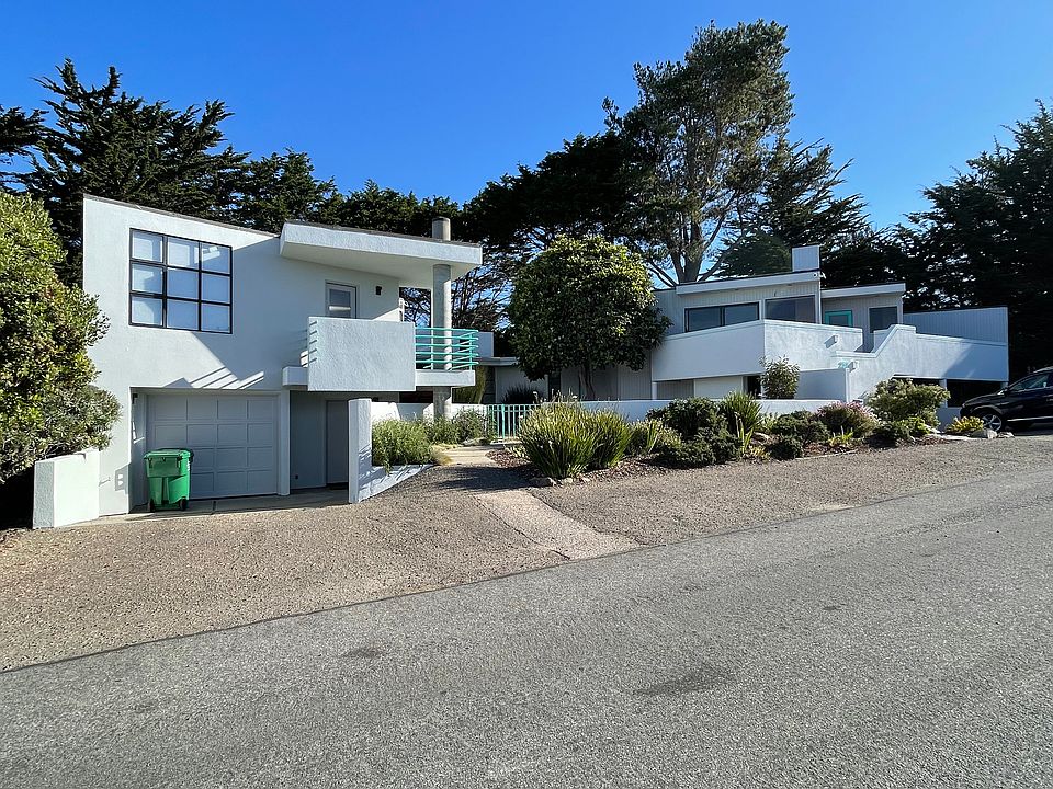 Home offered for rent includes the central garden area, garage, 3 bedrooms and 3 baths and driveway on right portion.