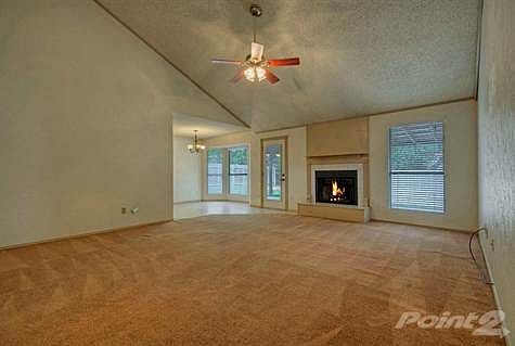 Step inside the front door and you are greeted with vaulted ceilings, a spacious living room and ple