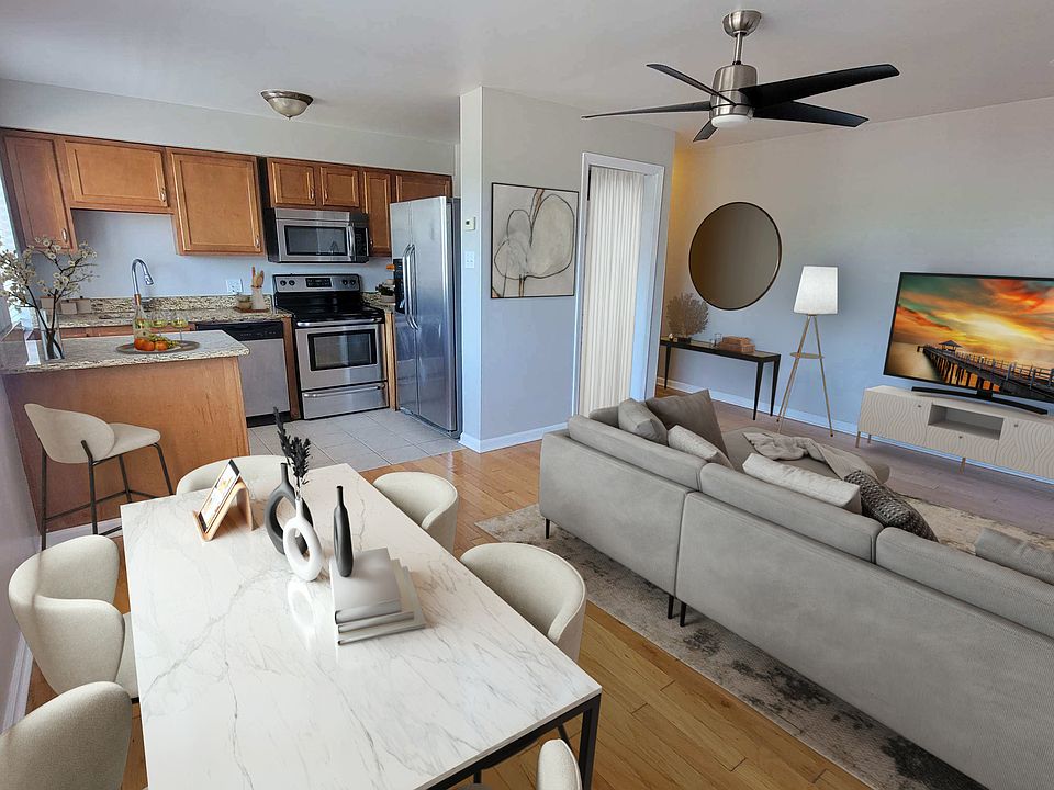 Open and spacious living room 
beautiful hardwood floors 
sun-lite 
sleek ceiling fan 
eat at kitchen island