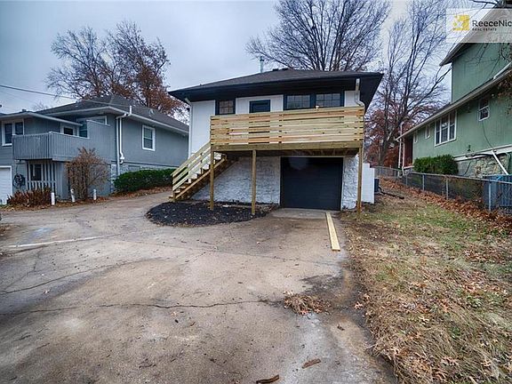 New deck, basement garage, spacious driveway & backyard
