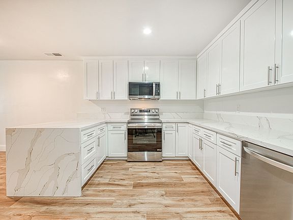 Luxury Kitchen & Appliances, LVP Flooring, Quartz Countertops, Central Heating & Cooling, New Windows.