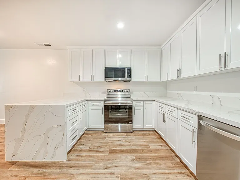 Luxury Kitchen & Appliances, LVP Flooring, Quartz Countertops, Central Heating & Cooling, New Windows.