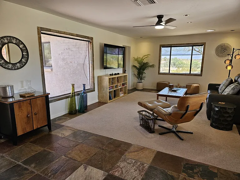 Living room has east, south and northern views.