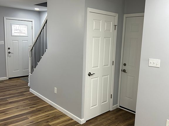 Kitchen looking at basement door and side access door (from porch).