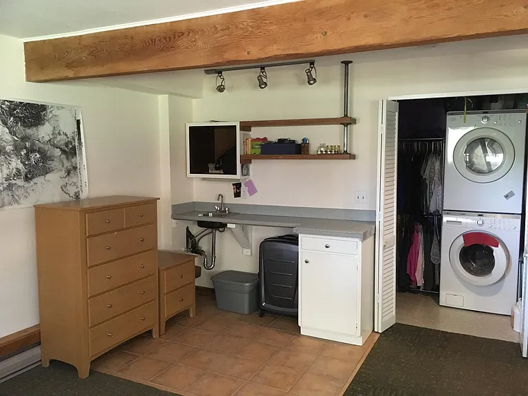 Lower-level; utility closet (washer/dryer; water tank for so
